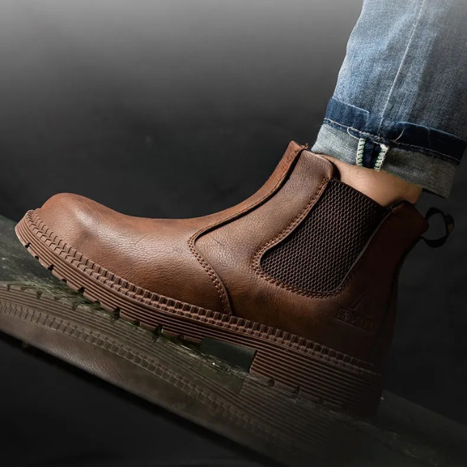 Durable brown Chelsea work boots with steel toe protection, ideal for construction & industrial work environments.