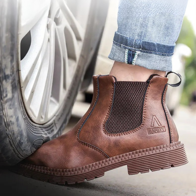 Stylish black slip-on Chelsea work boots featuring steel toe safety & all-day comfort for professionals.
