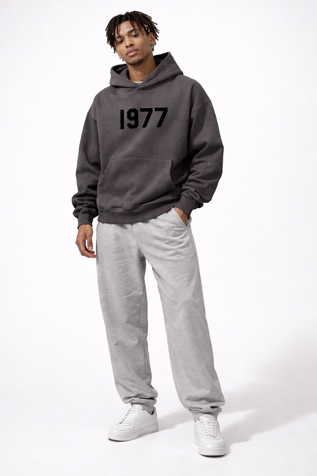 Casual vintage 1977 print hoodie with raglan sleeves, great for a modern streetwear look.