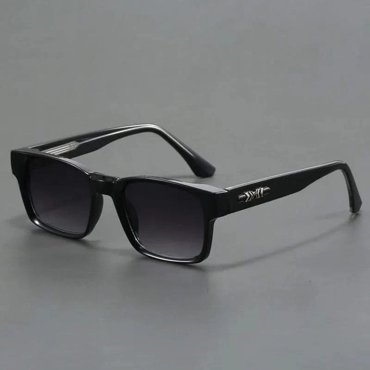 Elegant squared sunglasses with UV protection. Unisex eyewear for a chic and protected look.
