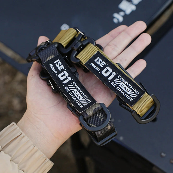 Tactical gear strap hook clip in use, securing a canteen to a tactical vest, camping accessory