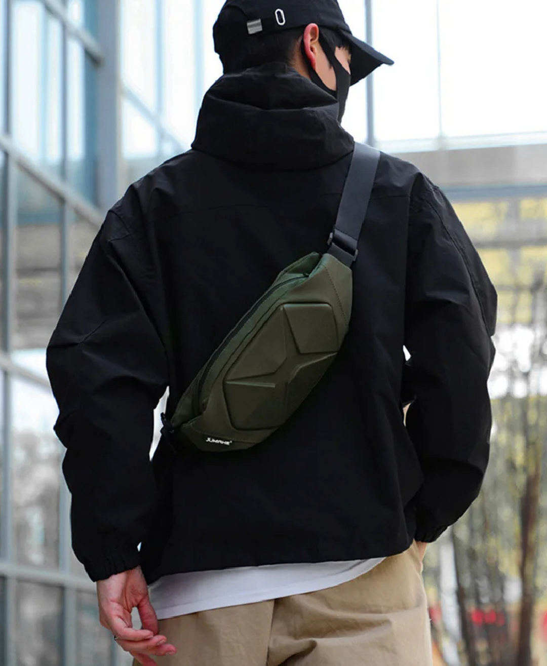 Front view of the unisex tactical hard shell crossbody bag, showcasing its rigid structure & style.