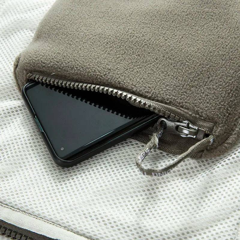 Detail of fleece lining inside unisex thermal tactical jacket, ensuring warmth for outdoor sports