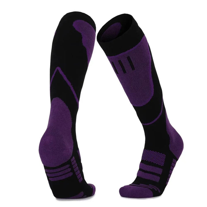 Collection of unisex thermal socks in various colors, ideal for skiing, snowboarding, and other winter sports.
