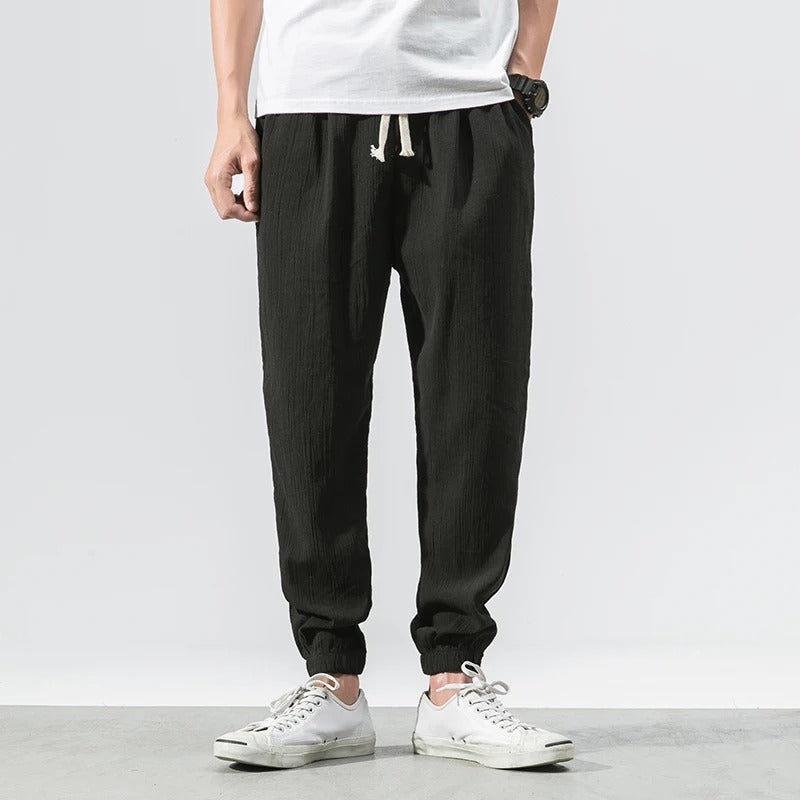 Soft cotton blend joggers with breathable fabric & deep pockets for unisex activewear & comfort.
