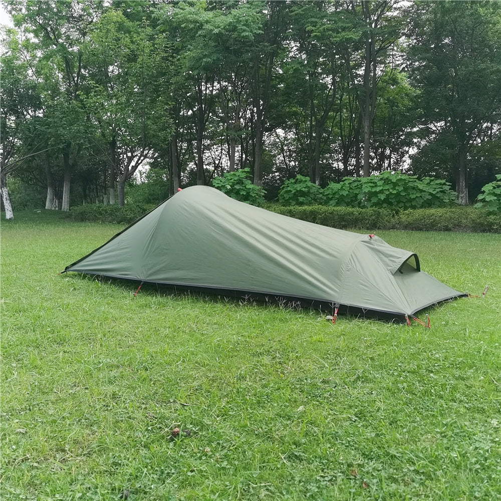 Interior view of a spacious ultralight 1-person tent with enough room for a sleeping pad & gear.