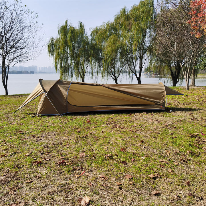 Backpacking bivy tent isolated on a white background, highlighting its design and features.