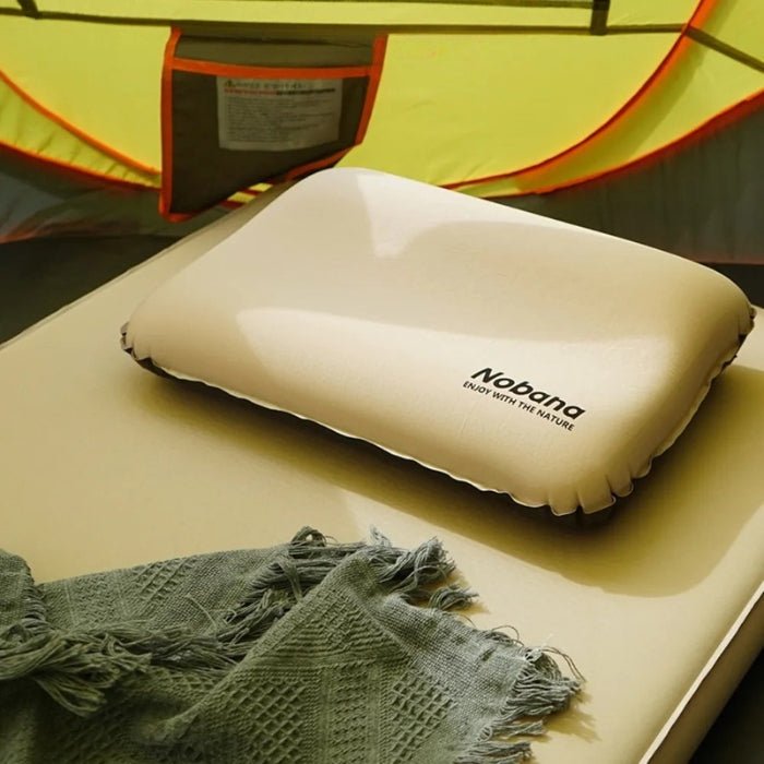Unisex ultralight inflatable camping pillow, compact for travel and outdoor sleeping gear.