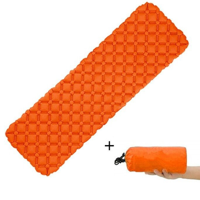 Unisex ultralight outdoor sleeping pad rolled up with strap, ideal for camping and hiking.