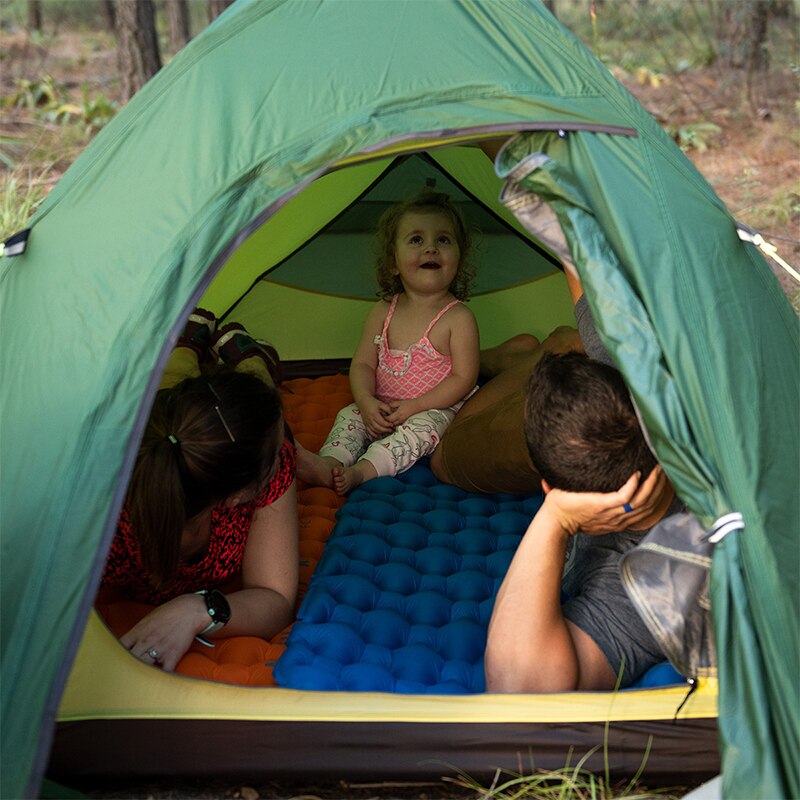 Sleeping pad and other camping gear neatly packed, showing its readiness for adventure.