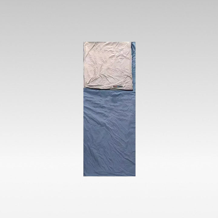 Unisex ultralight washable envelope sleeping bag for camping, side view, rolled up for travel