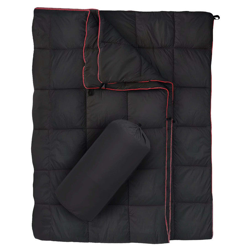 Adventure-ready water-resistant blanket, folded neatly with other hiking gear.