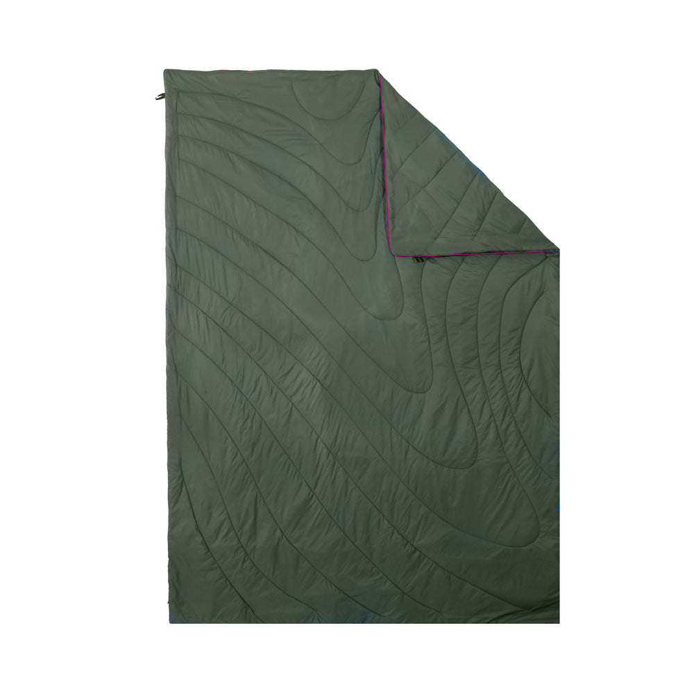 Camping blanket demonstrating its water resistance, repelling droplets.