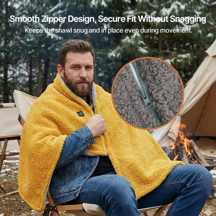 Person relaxing outdoors wearing a portable USB heated blanket, suitable for camping and cold weather.