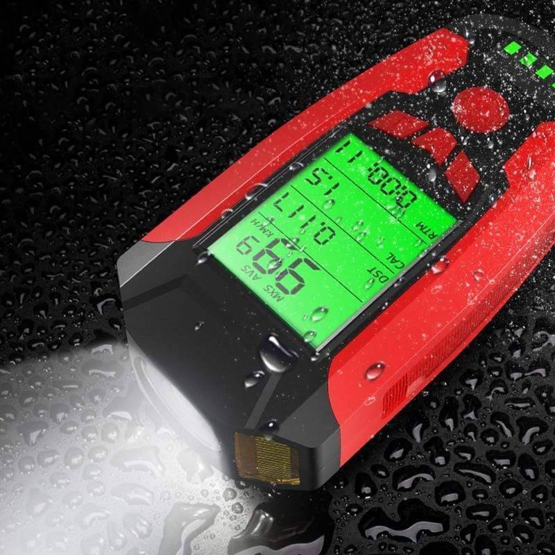 Close-up of waterproof cycling light with horn button and speedometer screen, bike accessory