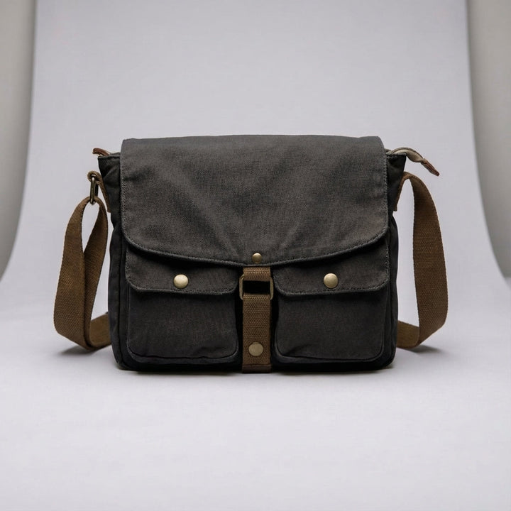 Classic vintage canvas messenger bag, unisex, featuring adjustable strap for comfortable crossbody wear.