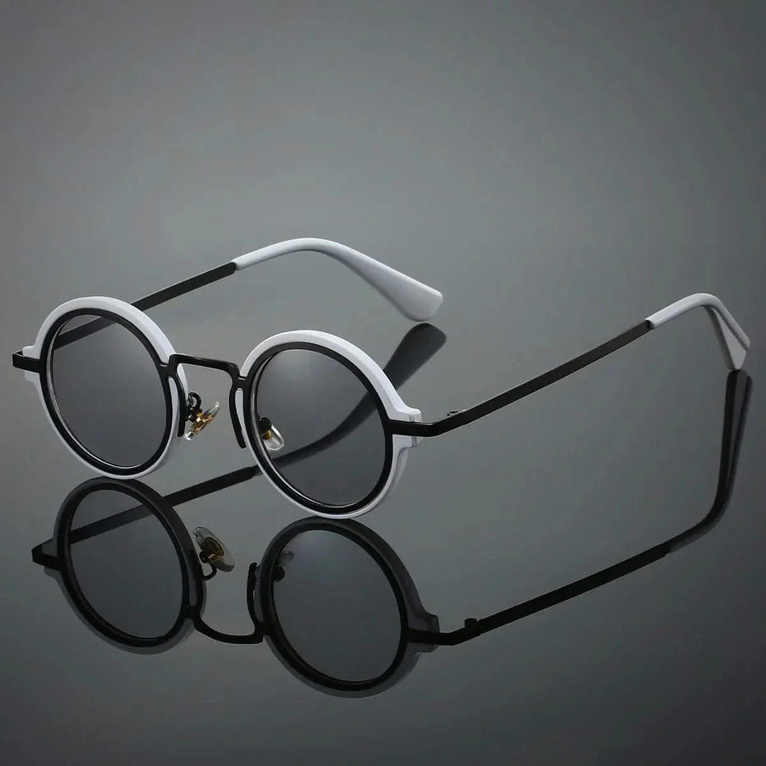 Stylish black round sunglasses, unisex, with glare-resistant lenses & lightweight design.