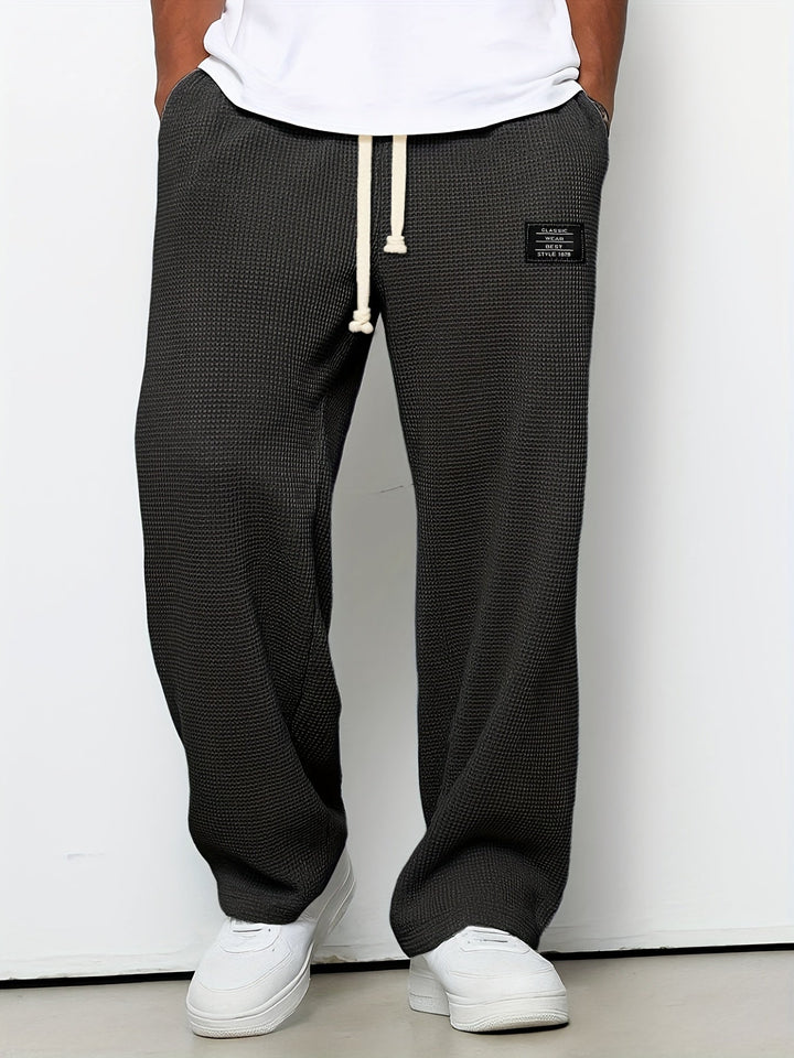 Relaxed fit unisex waffle knit pants. Soft, wide-leg lounge pants, perfect for ultimate comfort.