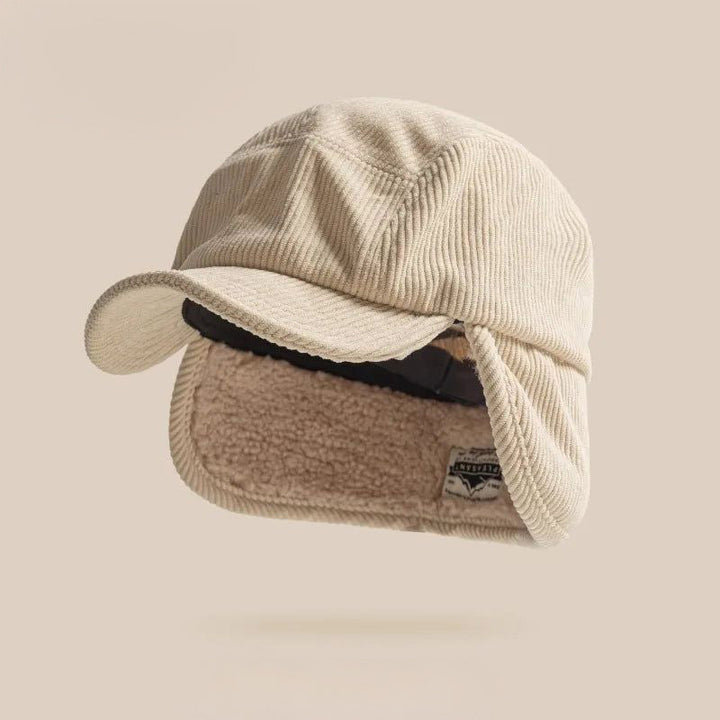 Soft beige knit earflap hat, a cozy unisex winter cap for maximum warmth and comfort.
