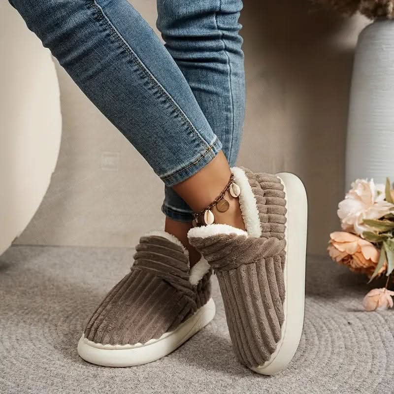 Soft unisex thermal house slippers, ideal for keeping feet warm in cold weather.
