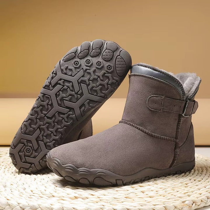 Barefoot winter boots for natural movement, keeping feet warm and comfortable in cold weather.