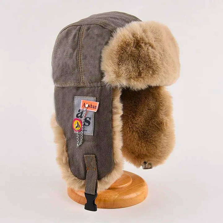Unisex warm winter trapper hat with luxurious faux fur lining and ear flaps for ultimate cold weather protection.