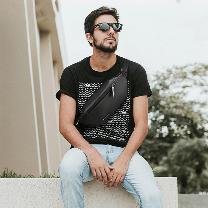 Hands-free unisex waist pack for travel, sport, & outdoor adventures. Water-resistant multi-pocket design.