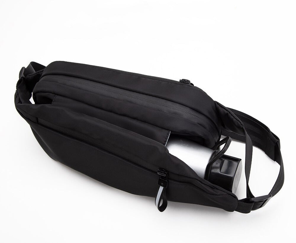 Convenient multi-pocket unisex fanny pack for hands-free travel. Water-resistant for sport & outdoor adventures.