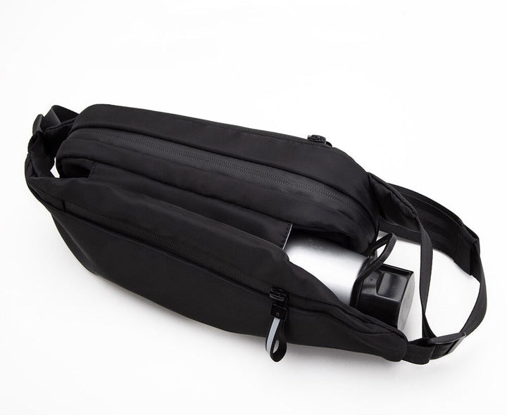 Convenient multi-pocket unisex fanny pack for hands-free travel. Water-resistant for sport & outdoor adventures.