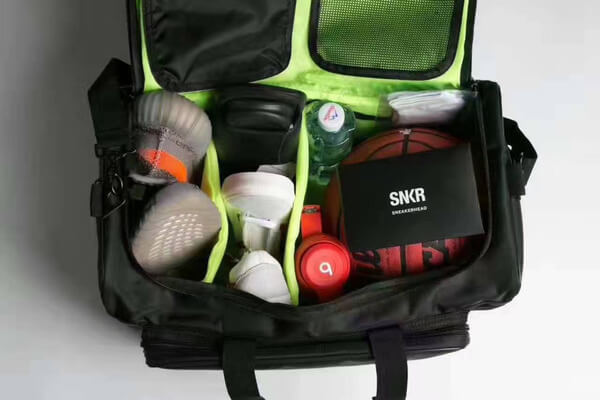 Convenient water-resistant unisex travel duffel bag, ideal for transporting sneakers & sports gear.