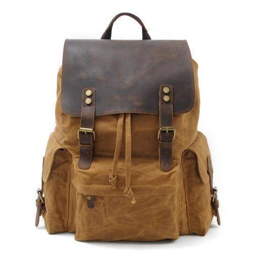 Detail shot of the durable hardware and stitching on a waterproof canvas leather backpack