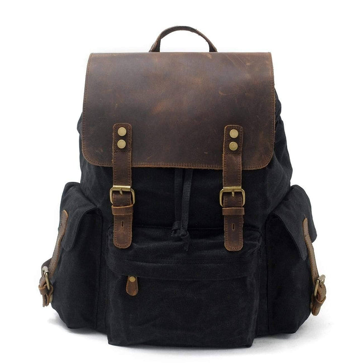 Close-up of waterproof canvas texture and leather straps on a durable travel backpack