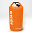 Dry bag floating in water during a beach outing, showcasing its waterproof capabilities and durability