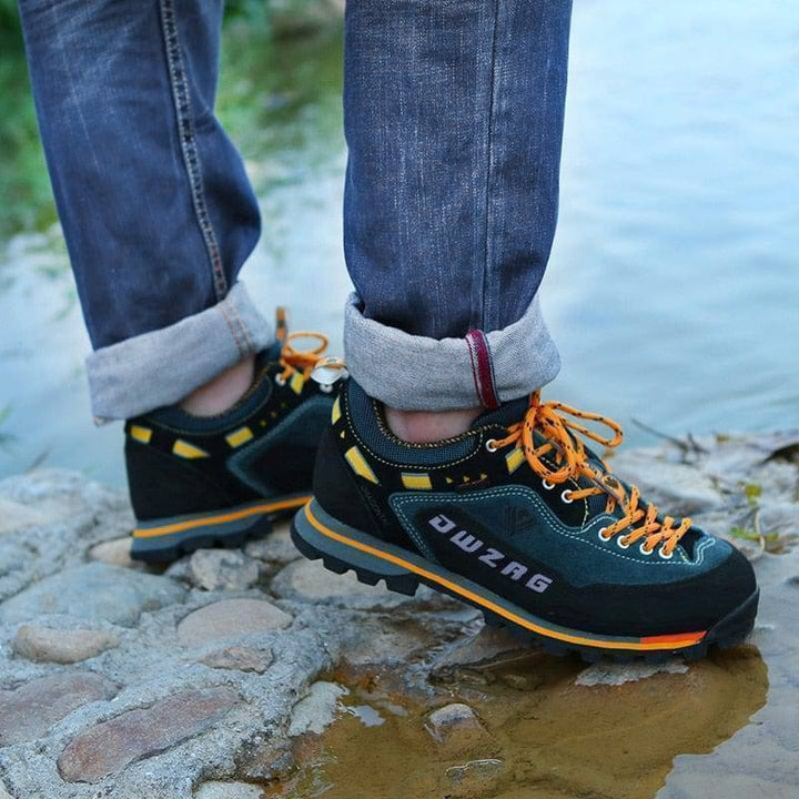 Unisex waterproof trekking shoes, side view, showing ankle support and durable design