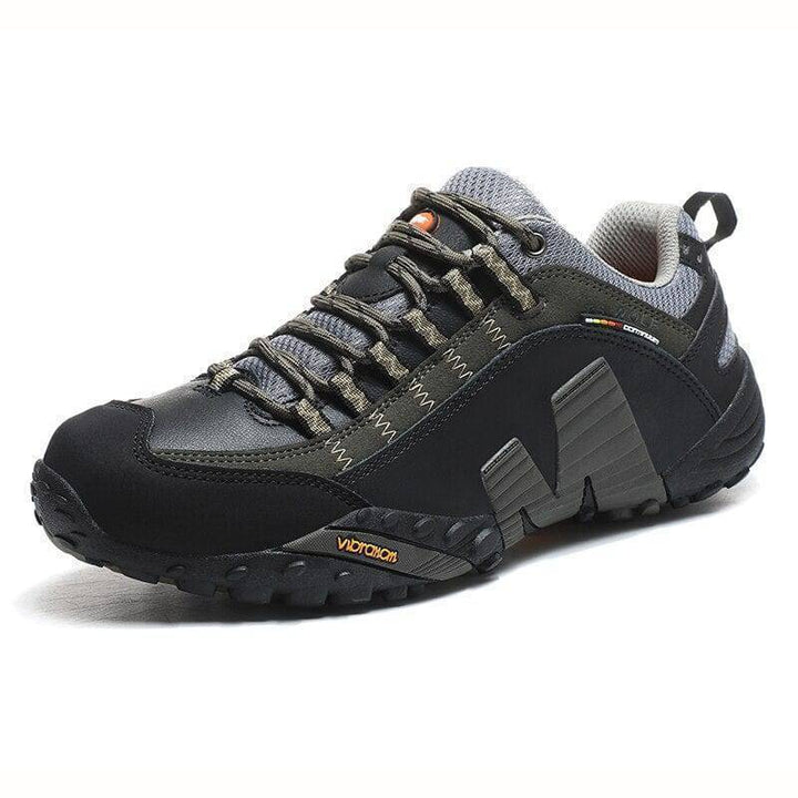 Unisex waterproof hiking boots on a rocky trail, highlighting their durability and grip