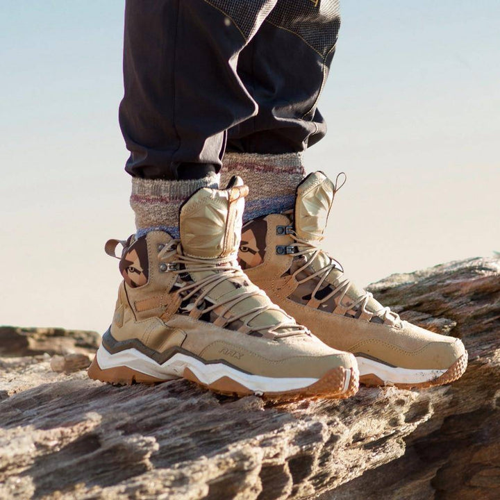 Unisex waterproof mid-top hiking boots for trekking, durable outdoor footwear with suede accents