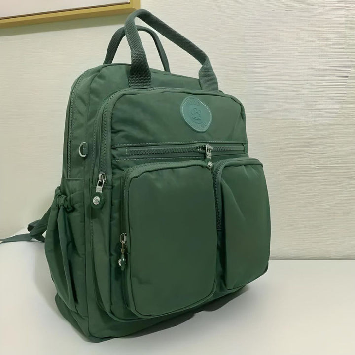 Versatile unisex waterproof urban backpack. Features multiple pockets for ultimate organization & style.