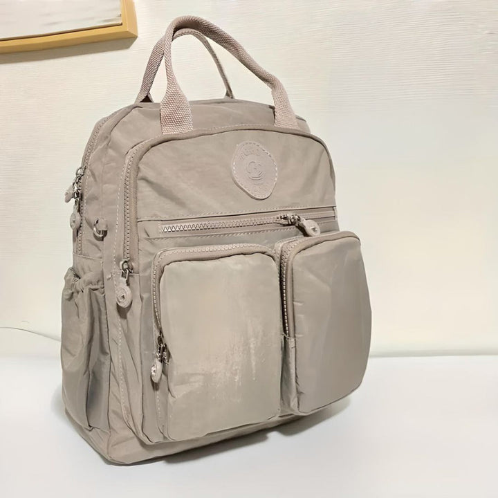 Stylish multi-pocket waterproof urban backpack, perfect for daily use & laptop storage.