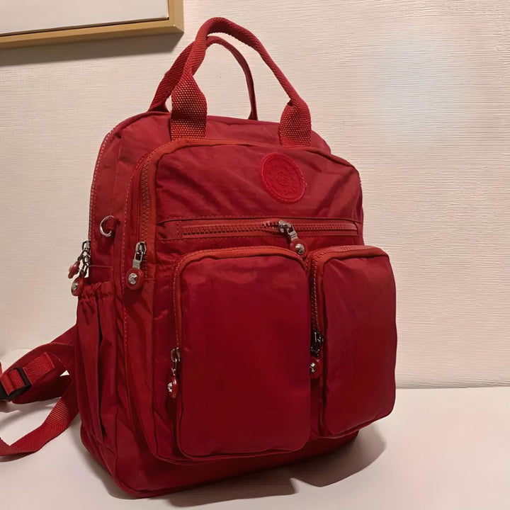 Modern waterproof travel bag. Urban backpack with multiple compartments for organized packing.