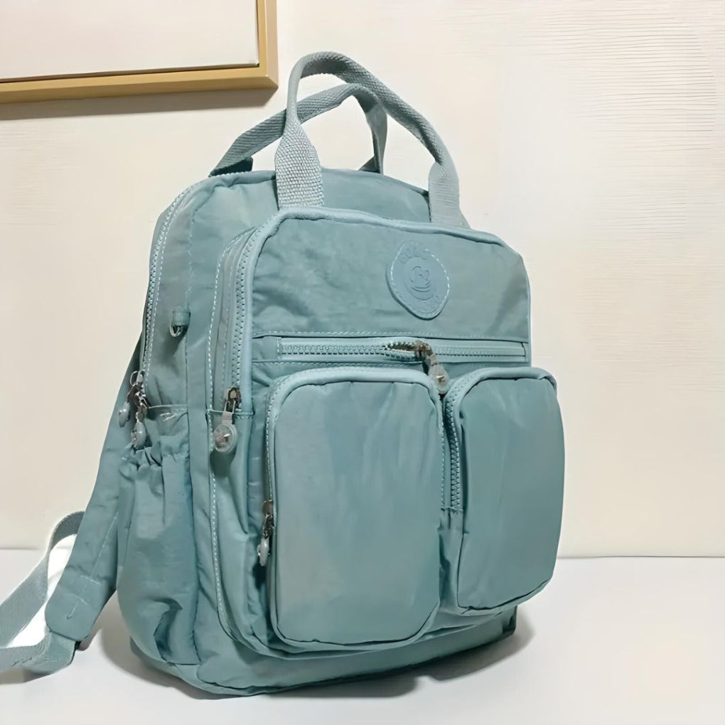 Fashionable unisex urban backpack. Waterproof design with practical multi-pockets for city life.
