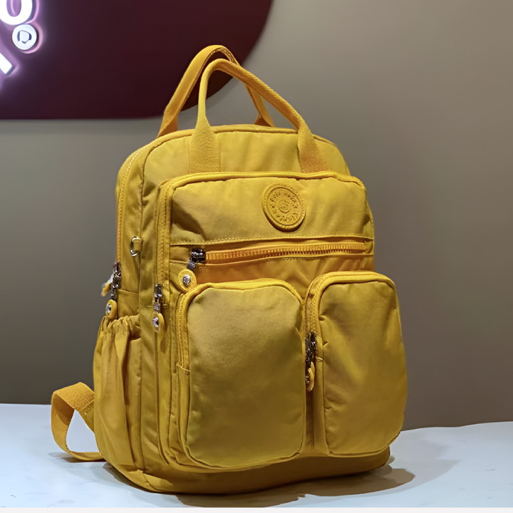 Sleek waterproof daily backpack. Urban style with multiple pockets, ideal for work & leisure.