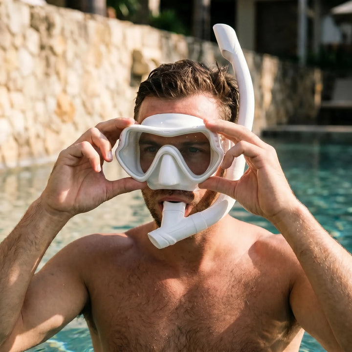 Unisex wide view snorkeling mask with tempered glass for crystal clear underwater vision.