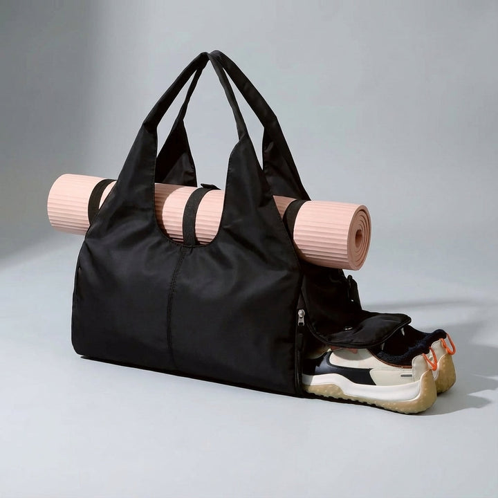 Yoga duffel bag showcasing side shoe compartment, wet pocket, and spacious main storage area.