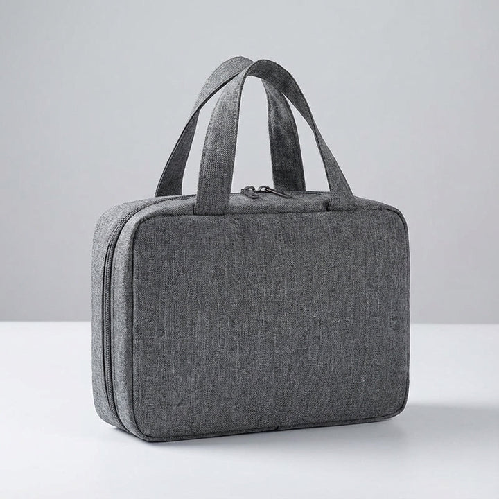 Hanging travel toiletry bag with multiple compartments. Organize cosmetics & bathroom essentials easily.