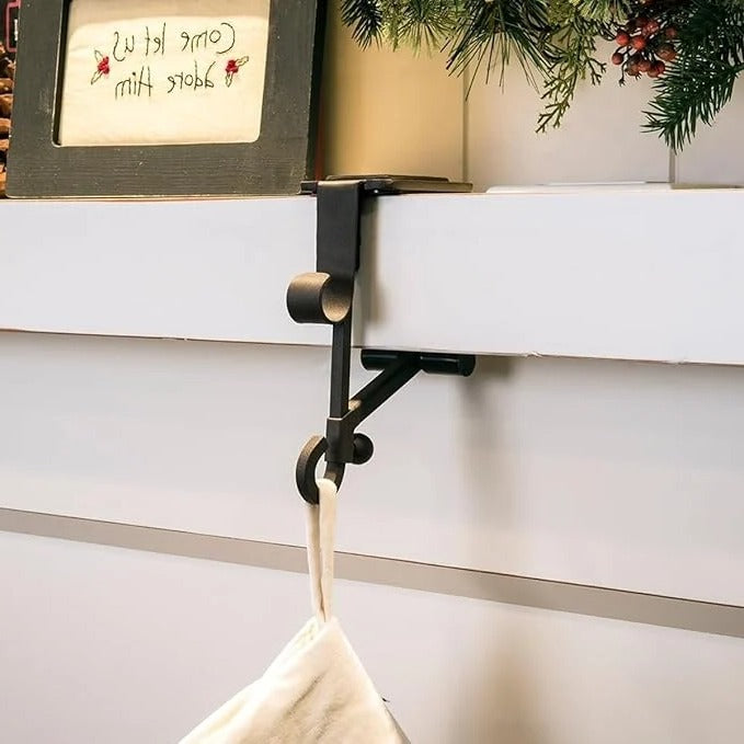 Adjustable gold Christmas stocking holder for mantle. Secure holiday hanger solution.