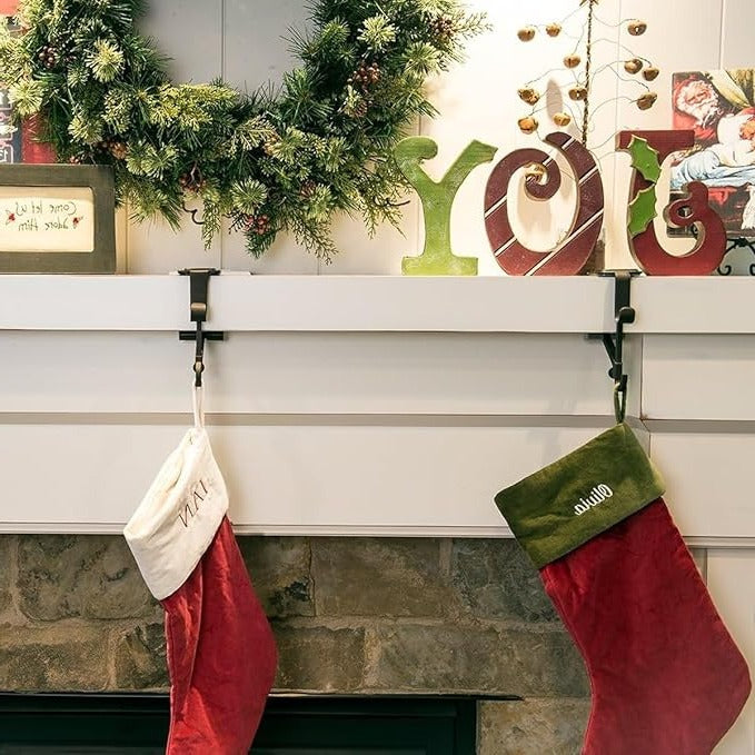Elegant gold Christmas stocking holder. No-slip design for secure holiday mantle decor.
