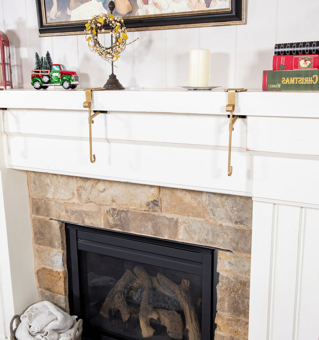 Decorative gold Christmas mantle holder for stockings. Essential holiday home decor item.