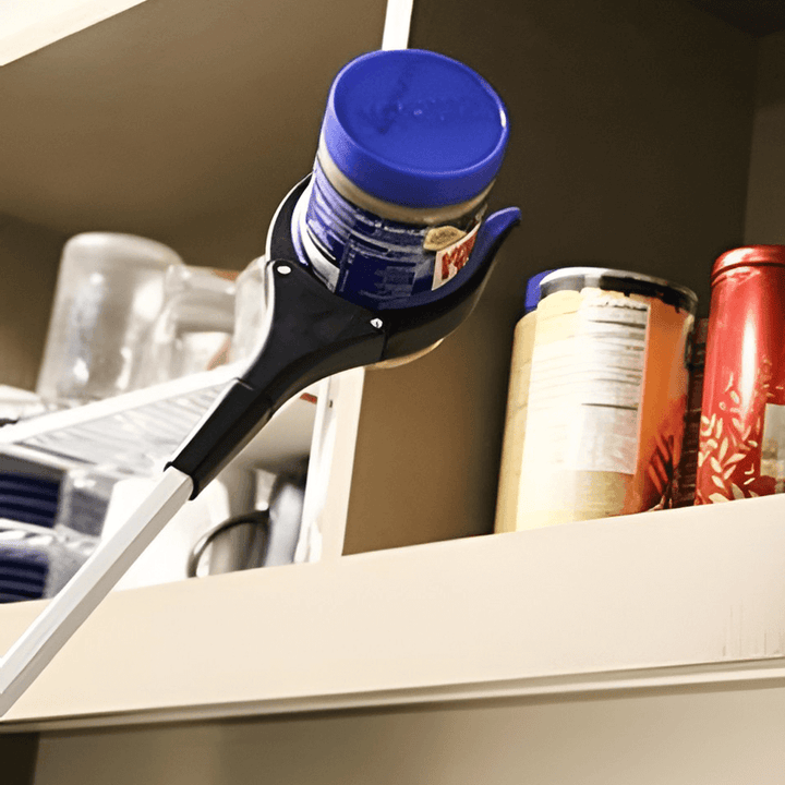 Portable reach tool, extends reach for household tasks. Ideal mobility aid for picking up dropped items.