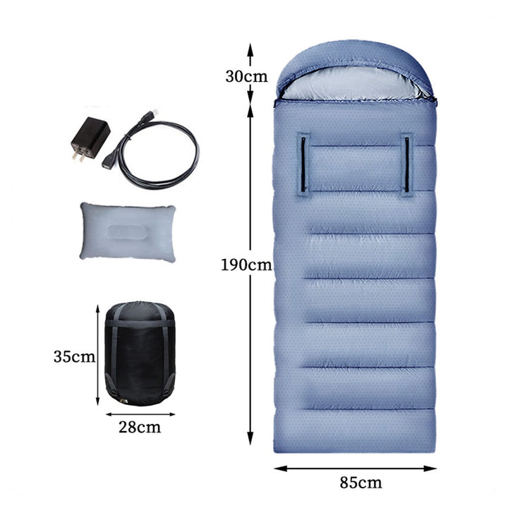 Adventure seeker standing next to a campfire with a USB heated sleeping bag at a winter campsite.