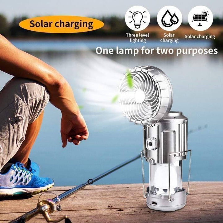 USB rechargeable solar camping lantern with fan, LED light, and portable design for outdoor use.